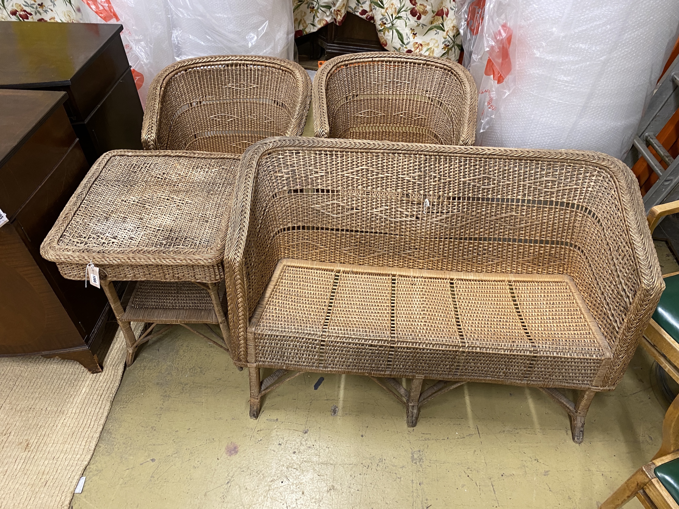 A vintage wicker four piece conservatory suite, settee length 122cm, depth 56cm, height 70cm